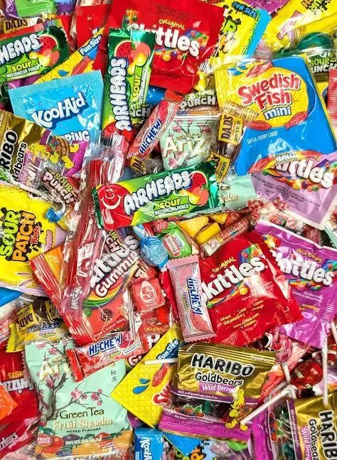 Image of a pile of variety individually wrapped candies.